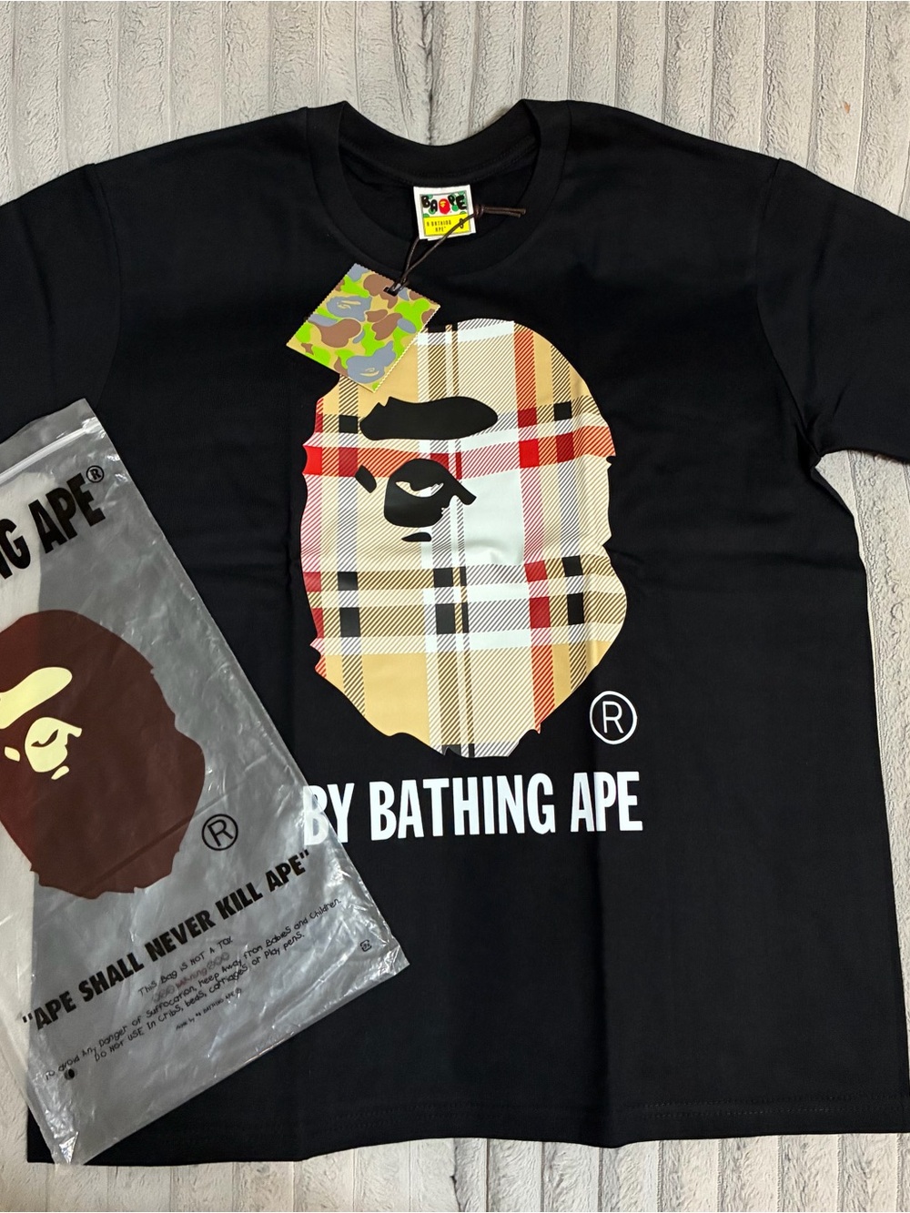 A Bathing Ape Black Logo Tee with Plaid Ape Graphic